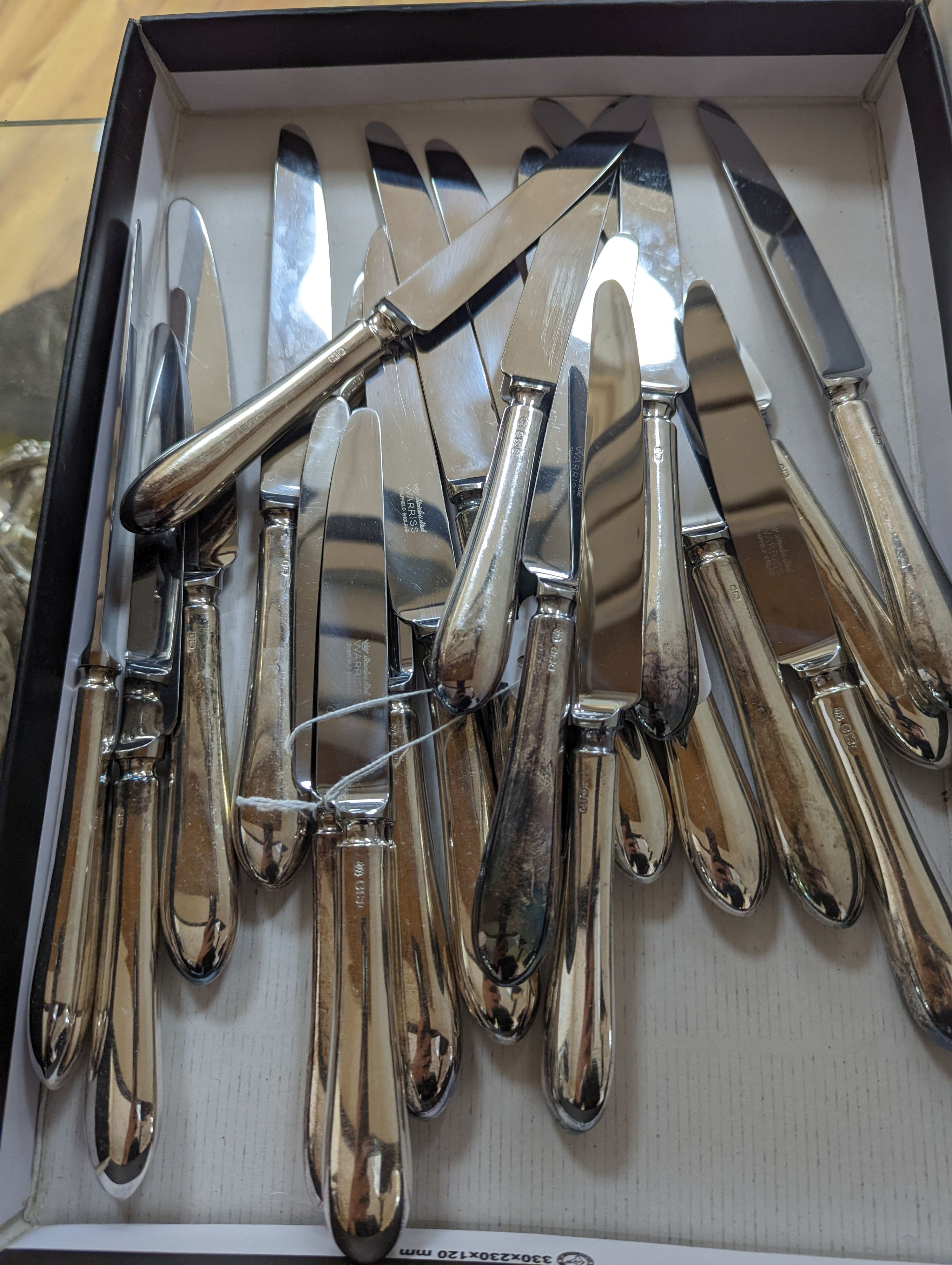 A modern set of twelve silver handled steel table knives and twelve dessert forks, Sheffield, 1979.